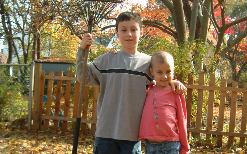 Pictured here: Patrick, age 8 and Alex, age 7 outside their home in Wynnewood, PA in the fall of 2003.