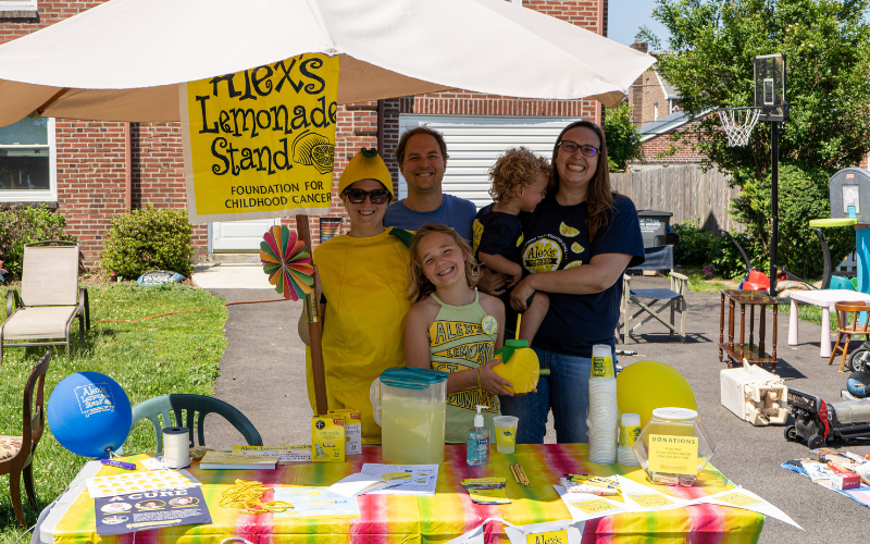 family at lemonade stand