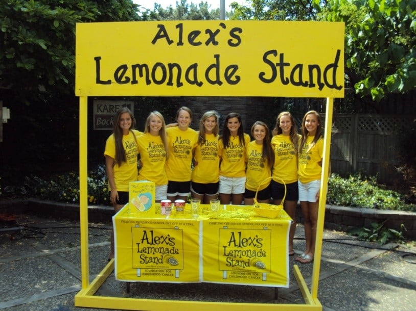 Group of students behind an Alex's Lemonade Stand